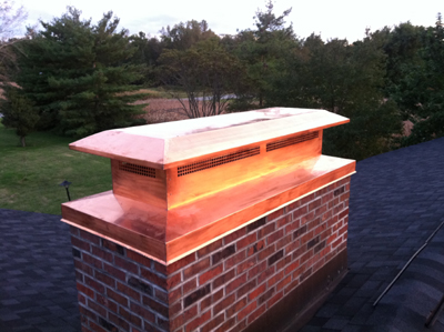 Before and after chimney cap replacement in Manhasset, NY