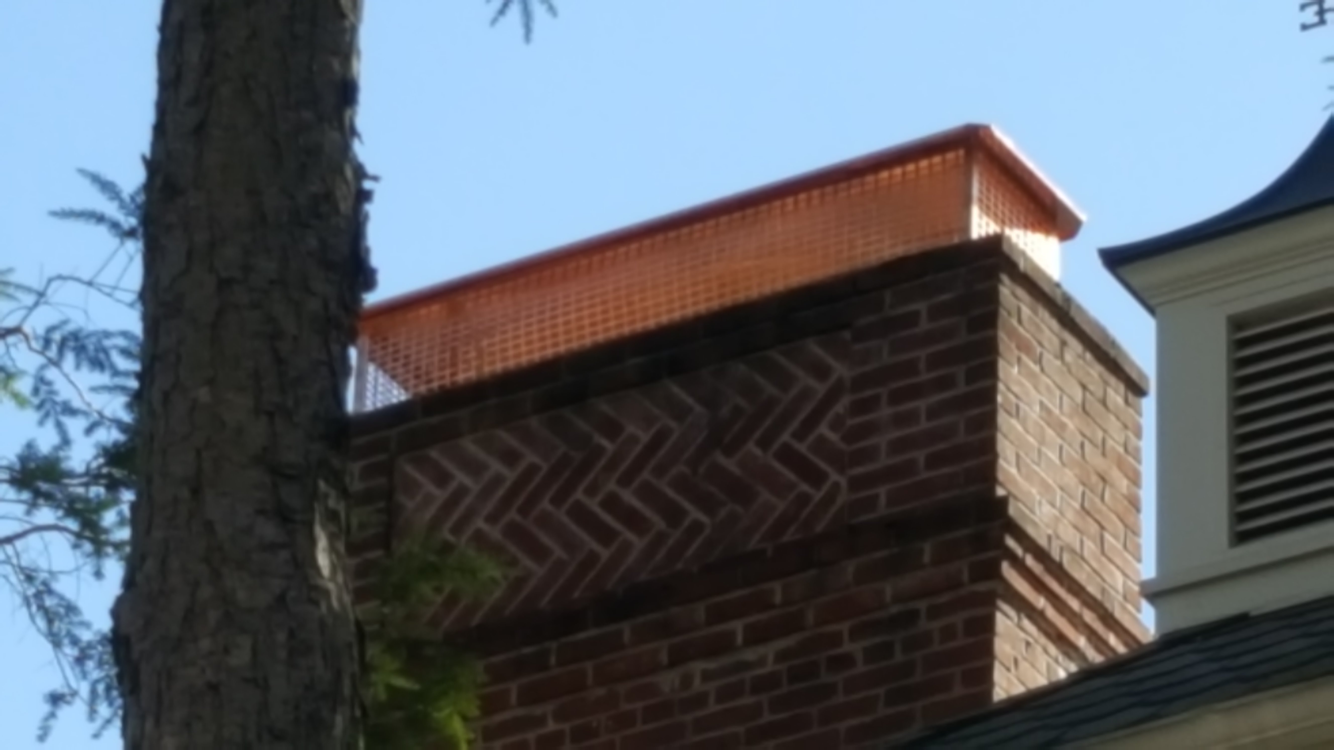 New stainless steel chimney cap installed in Manhasset, NY