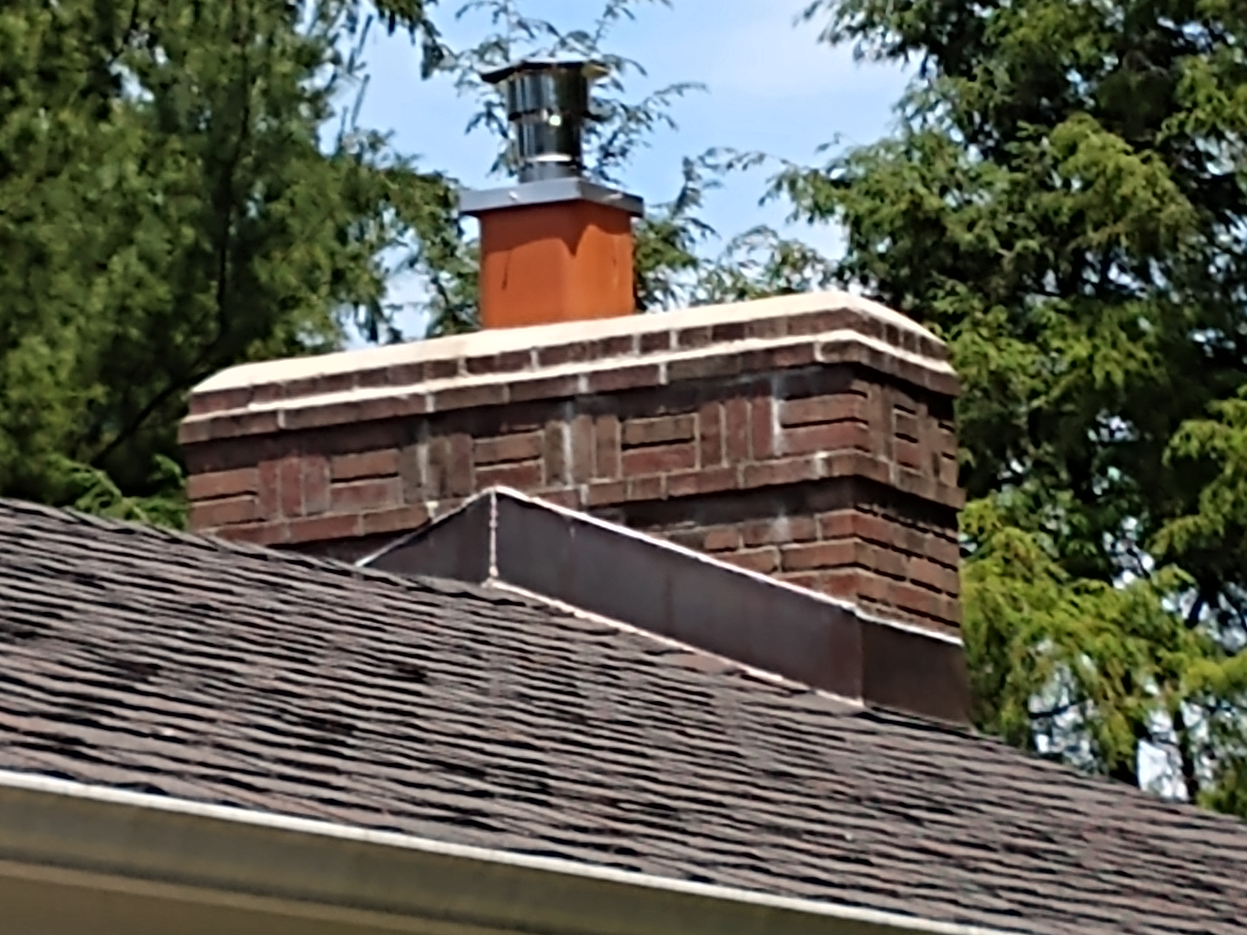 Stainless steel chimney cap with animal guard in Manhasset, New York